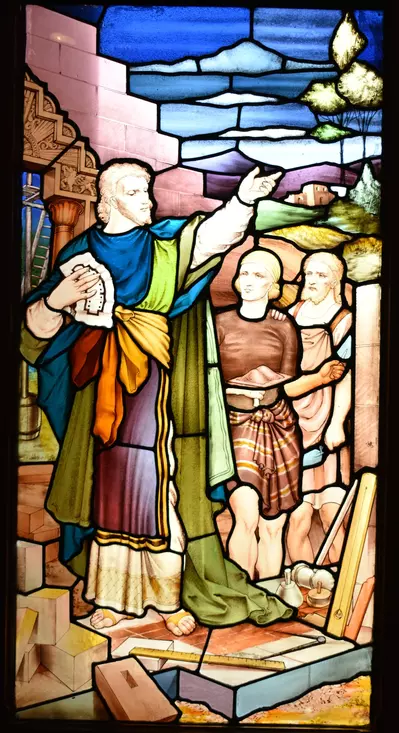 Stained glass window, depicting three men with masonry tools